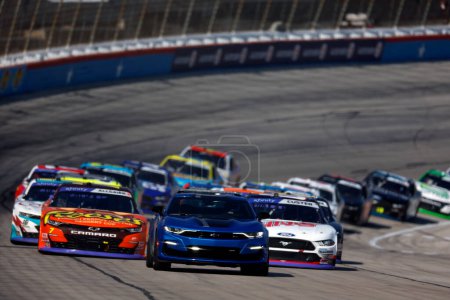 Photo for NASCAR Xfinity Series Driver, Justin Allgaier (7) leads the field for the Andy's Frozen Custard 300 at the Texas Motor Speedway in Fort Worth TX. - Royalty Free Image