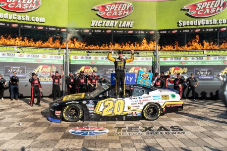 Photo for NASCAR Xfinity Series Driver John Hunter Nemechek (20) celebrates his win for the Andy's Frozen Custard 300 at the Texas Motor Speedway in Fort Worth TX. - Royalty Free Image