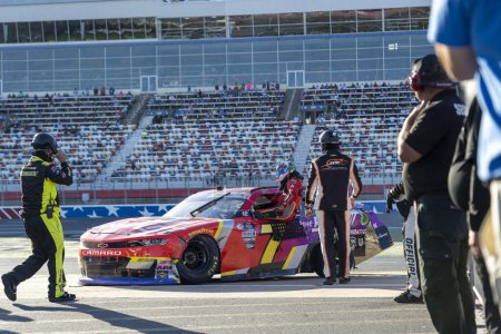 Photo for NASCAR Xfinty Series Justin Allgaier (7) gets out of his car after wrecking for the Drive for the Cure 250 presented by BlueCross BlieSheild of North Carolina at the Charlotte Motor Speedway in Concord NC. - Royalty Free Image