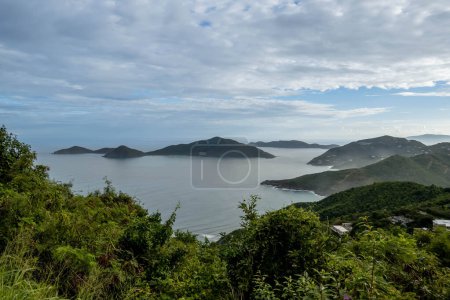 Photo for Tortola, in the British Virgin Islands, captivates with lush hills, white sand beaches, and vibrant homes, showcasing Caribbean charm amid stunning seascapes - Royalty Free Image