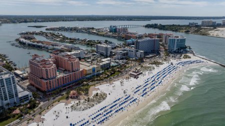 Capturing Clearwater Beach vibrant Spring Break from abovea drones perspective reveals sun kissed shores, lively crowds, and joyful beachgoers savoring the warmth of a perfect spring day.