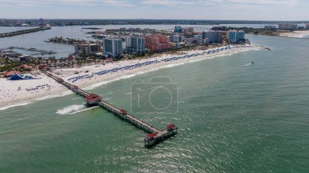 Capturing Clearwater Beach vibrant Spring Break from abovea drones perspective reveals sun kissed shores, lively crowds, and joyful beachgoers savoring the warmth of a perfect spring day.