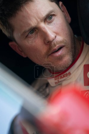 Photo for Denny Hamlin waits for practice to begin for the Shiners Children's 500 in Avondale, AZ, USA - Royalty Free Image