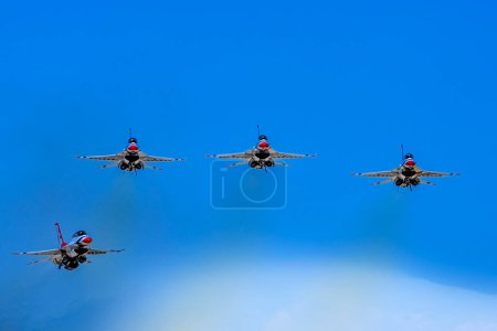 Photo for March 01, 2024-El Centro, CA:  Thunderbirds refine aerial maneuvers in spring training, showcasing Air Force excellence worldwide in precision and skillful formations. - Royalty Free Image