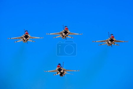 Photo for March 01, 2024-El Centro, CA:  Thunderbirds refine aerial maneuvers in spring training, showcasing Air Force excellence worldwide in precision and skillful formations. - Royalty Free Image