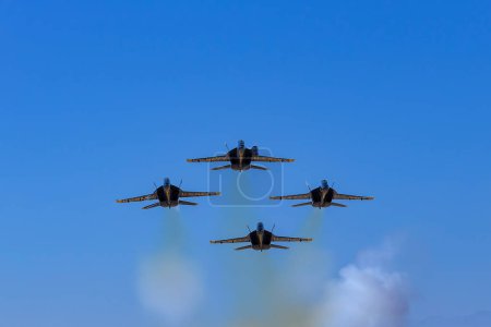 Photo for March 01, 2024-El Centro, CA:  Blue Angels rehearse precision aerobatics before season debut, showcasing skill and teamwork in high-flying maneuvers. - Royalty Free Image