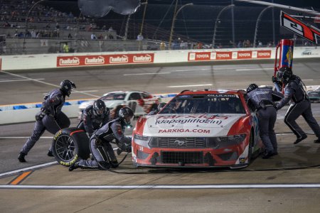 Photo for NASCAR Cup Series driver, TODD GILLILAND and crew make a pit stop during the Toyota Owners 400 in Richmond, VA, USA - Royalty Free Image
