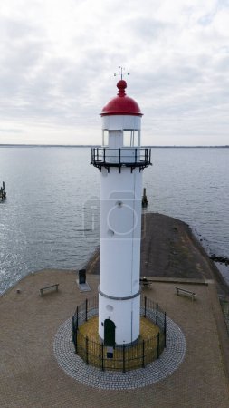 Photo for The lighthouse in Hellevoetsluisin the netherlands made with a drone aerial view - Royalty Free Image