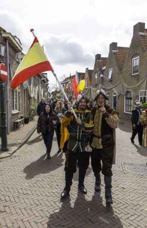 Photo for Brielle,Holland,1-04-2024:people with the spanish flag in traditional traditional costumes celebration of the the first town to be liberated from the Spanish in Den Briel in the Netherlands in 1572 - Royalty Free Image