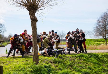Photo for Brielle,Holland,1-04-2024:people in battle intraditional traditional costumes celebration of the the first town to be liberated from the Spanish in Den Briel in the Netherlands in 1572 - Royalty Free Image