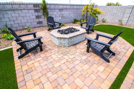Photo for Back Yard Fire Pit With Four Wooden Arm Chairs - Royalty Free Image
