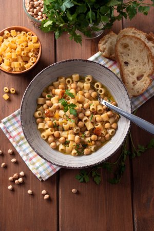 Photo for Dish of delicious traditional pasta and ceci, a soup of pasta and chickpeas, Italian cuisine - Royalty Free Image