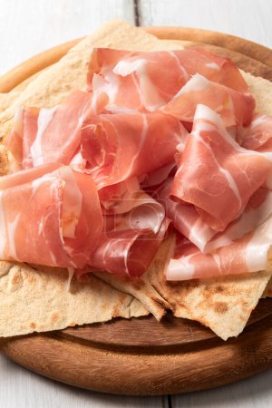 Photo for Closeup of delicious traditional italian prosciutto, european food - Royalty Free Image