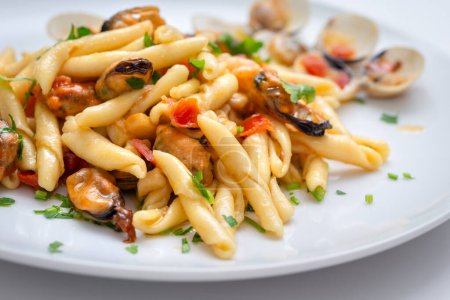 Dish of delicious pasta with seafood sauce, italian cuisine