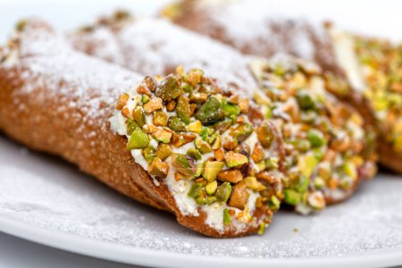 Photo for Traditional Sicilian cannoli filled with ricotta and pistachios, italian dessert - Royalty Free Image