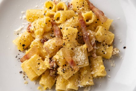 Photo for Delicious typical carbonara macaroni, a classic recipe of italian pasta, european food - Royalty Free Image