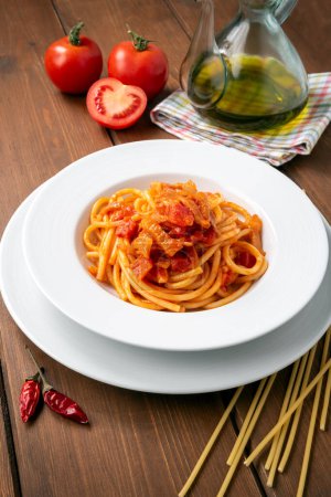 Photo for Dish of delicious spaghetti with tomatoes and pork, Italian food, typical Mediterranean diet - Royalty Free Image
