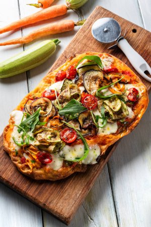 Photo for Delicious vegetarian pinsa, a typical roman pizza with vegetables, Italian food - Royalty Free Image