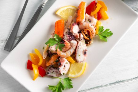 Photo for Dish of delicious Italian mixed seafood salad, European food - Royalty Free Image