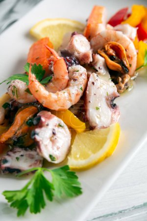 Photo for Dish of delicious Italian mixed seafood salad, European food - Royalty Free Image