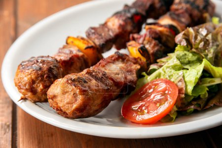 Photo for Close-up shot of delicious roasted meat on skewers - Royalty Free Image