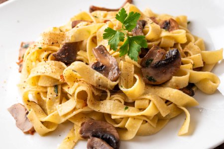 Photo for Closeup of delicious tagliatelle with mushrooms, italian pasta - Royalty Free Image
