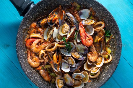 Photo for Pan with delicious seafood soup, italian food, mediterranean cuisine - Royalty Free Image