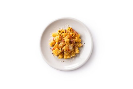 Plate of delicious pasta alla carbonara, a traditional roman recipe of pasta with egg, guanciale, pecorino and black pepper