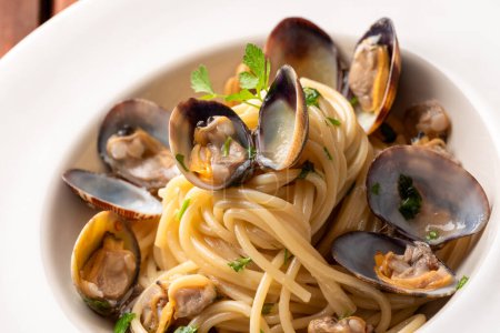 Photo for Delicious Spaghetti with clams, italian cuisine - Royalty Free Image