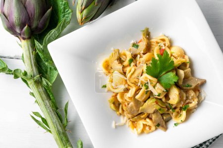 Photo for Delicious pappardelle with organic artichokes, vegetarian food - Royalty Free Image