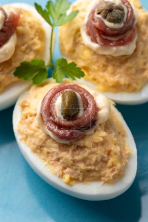 Photo for Delicious deviled eggs stuffed with tuna, mayonnaise and capers - Royalty Free Image
