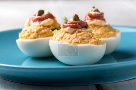 Photo for Delicious deviled eggs stuffed with tuna, mayonnaise and capers - Royalty Free Image