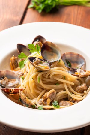 Photo for Plate of delicious spaghetti with mussels, clams and bottarga, Italian food - Royalty Free Image