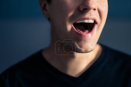 Photo for Sing, talk or speak. Singer mouth open. Man with loud sound of voice. Pronunciation in language education, articulation exercise or vocal lesson. Song in music studio. Speech or karaoke. Yell or shout - Royalty Free Image