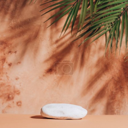 Photo for Natural empty background for cosmetic product presenation, packaging mockup made with stone and palm leaves. Minimal nature scene. Square photography. Toned image. - Royalty Free Image