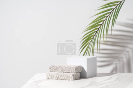 Foto de Empty podium for cosmetics beauty product presentation. Made with pumice stone on a bathroom table. Front view. - Imagen libre de derechos