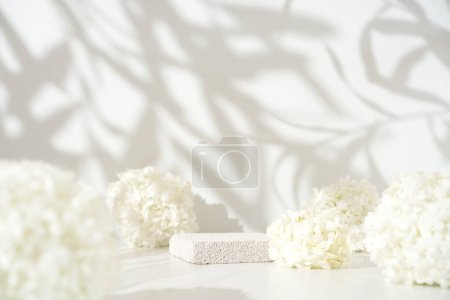 Photo for Delicate cosmetics skin care product presentation scene made with pumice stone podium and white lilac flowers - Royalty Free Image