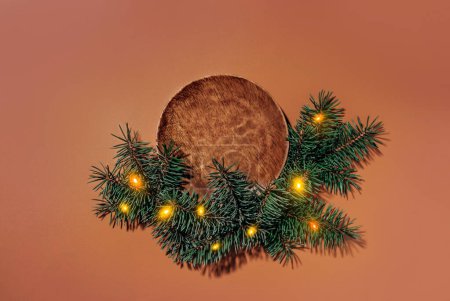 Winter Christmas mockup blank template for product presentation made with wooden plate and fir tree decor with lights