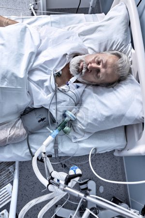 Foto de Top View On Senior Elderly Sick Man Injected, In modern Clinic Hospital, under the dropper, Alone. view from above. medicine, healthcare, sickness, coronavirus, covid-19, pneumonia - Imagen libre de derechos