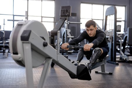Photo for Love of life. hardworking young man in stylish sportswear performs cardio workout - Royalty Free Image