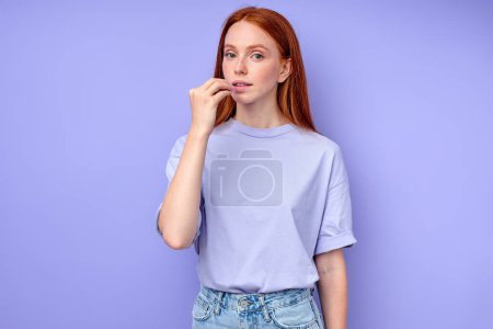 Photo for Young deaf mute woman saying that she likes something somebody. close up portrait , showing to her mouth, wants to eat - Royalty Free Image
