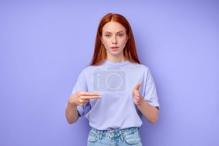 Photo for British sign language. A two-handed alphabet. Fingerspelling alphabet. ginger woman demonstrating number 200. - Royalty Free Image