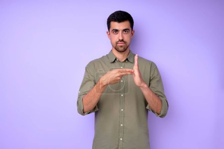 Photo for Attractive man showing number 200 with fingers and palm, hand close up portrait isolated blue background - Royalty Free Image