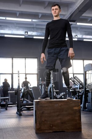 Photo for Ambitious motivated man in sportswear standing on box, full length photo. free time, spare time, health and body care. wellness - Royalty Free Image