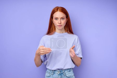 Photo for Confident attractive red-haired woman using Fingerspelling alphabet. closeup portrait isolated blue background, woman showing number 400 - Royalty Free Image