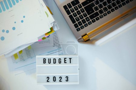 Photo for Budget and tax time. documents and laptop at table. - Royalty Free Image