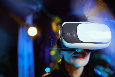 Photo for Closeup on middle aged woman in metaverse in vr goggles. - Royalty Free Image