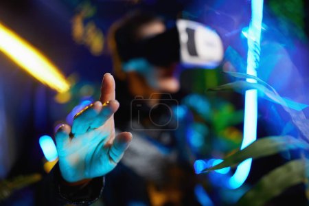 Photo for Closeup on middle aged woman in virtual reality in vr headset exploring. - Royalty Free Image