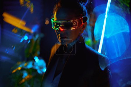 Photo for Silhouette of stylish business woman with futuristic goggles in virtual reality. - Royalty Free Image