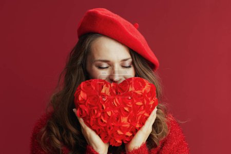 Photo for Happy Valentine. relaxed modern middle aged woman in red sweater and beret with red heart. - Royalty Free Image